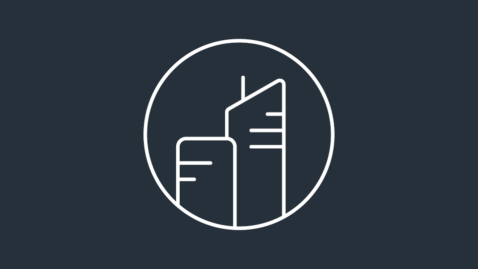 Circular icon showing simple line-art buildings.