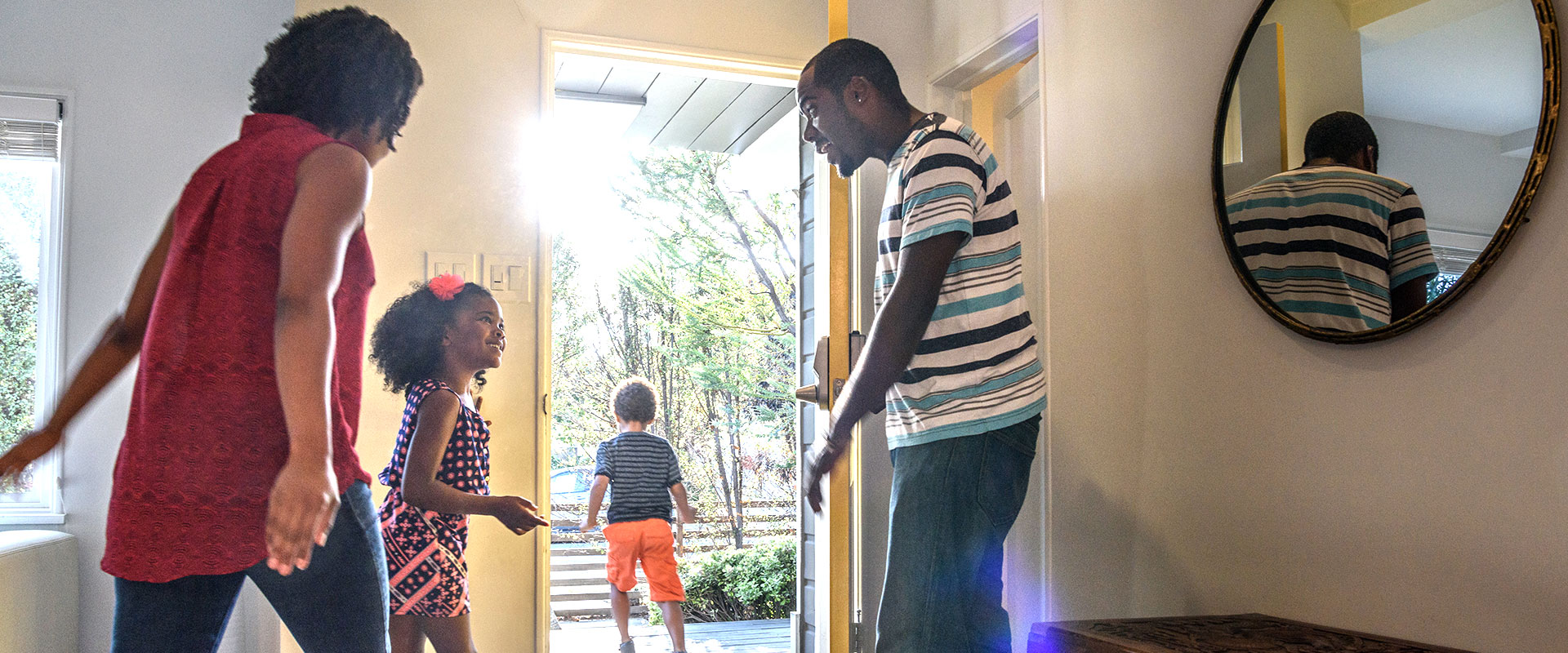 A family walking out their front door